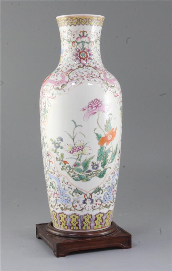A Chinese famille rose baluster vase, height 37.5cm, wood stand